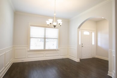 This dining room is a great size for your large table. It's full of light and beautifully accessorized  with updated trim all around. The dining room also leads directly into the large kitchen. 
