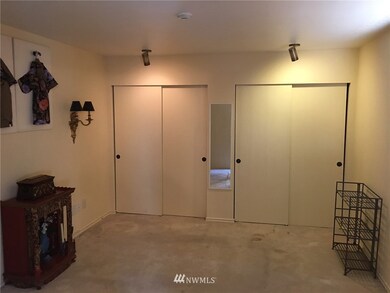 Master bedroom dual closets features custom shelving.