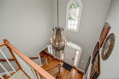 A soaring ceiling, second story window and chandel