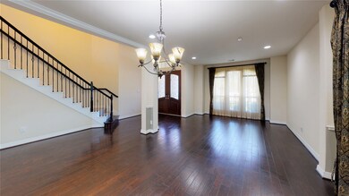 View from formal dining looking back at the double doors entry way.