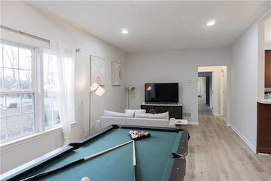 Game room featuring billiards, light wood finished