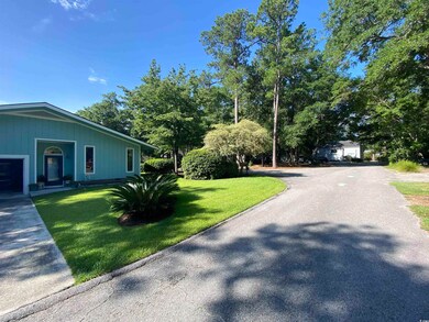 View of side of home with a lawn