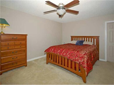 Beautiful master bedroom with carpet.