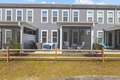 Rear view of house featuring a sunroom, fence, and a patio
