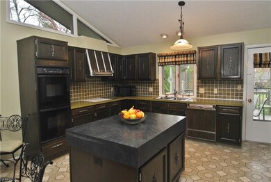 A cathedral ceiling highlights the expansive kitch