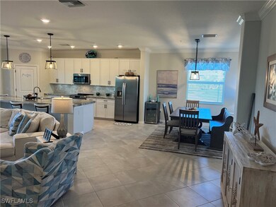 Kitchen featuring light tile patterned floors, sta