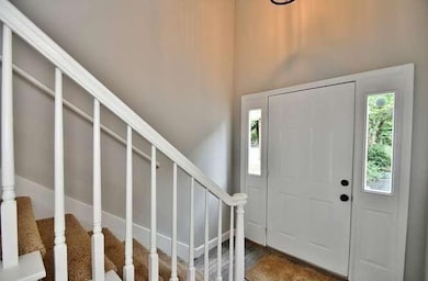 Foyer featuring stairway