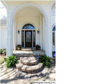 Gorgeous front entry stoop leads you into this ama