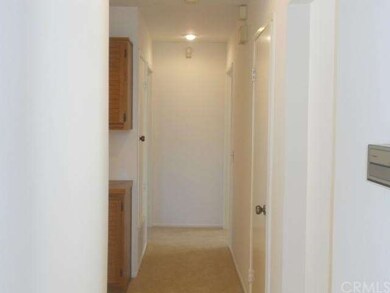 Hallway Leading to Full Bath and Back Bedrooms