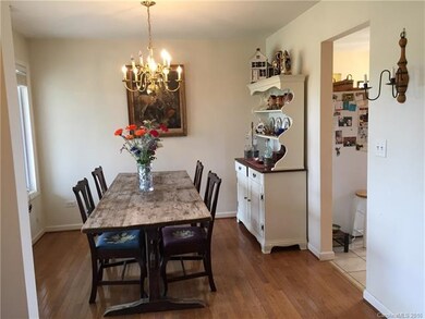 Sunny dining area with hardwood floors.