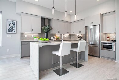 Gorgeously sleek kitchen defines this modern home.