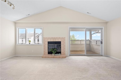 Living room with Cathedral ceilings and views of t