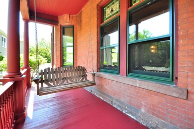 This porch is beckoning you to grab your favorite 