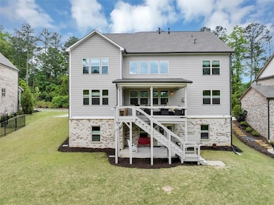 Rear view of property featuring a patio area, stai