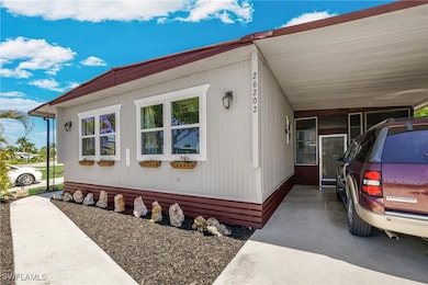 View of side of property with an attached carport