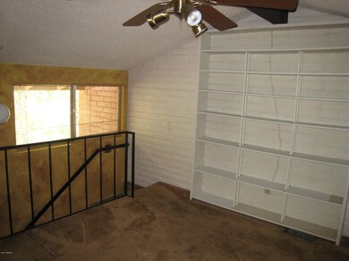 Loft w/ Bookshelves & Ceiling Fan
