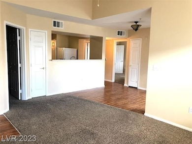 Spare room featuring baseboards, visible vents, da