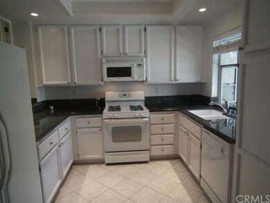 Well-equipped kitchen with recessed lighting and g