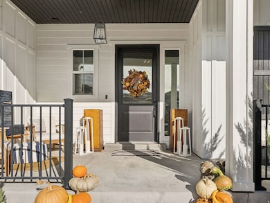 Entrance to property featuring a porch and board and batten siding