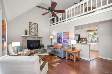 Living room featuring dark wood-type flooring, hig