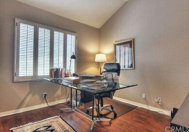 OFFICE WITH WOOD FLOORS VAULTED CEILINGS AND WALK-