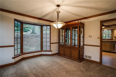 Dining room off kitchen with huge bay window!