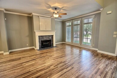 Gleaming hardwood floors, plantaion shutters, fire