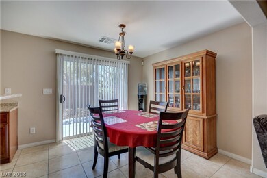 Roomy dining area with slider leading to the backy