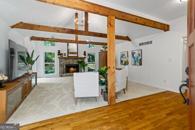 WOW factor of a GREAT room upon entry with plenty of natural light through windows and doors