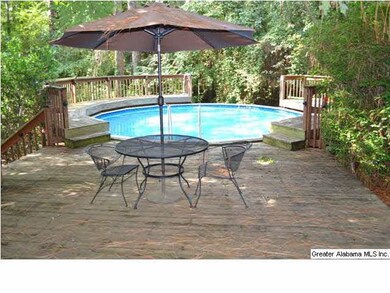 ABOVE GROUND POOL THAT OFFERS EXTENSIVE DECKING AN