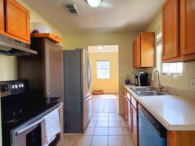Galley style kitchen with appliances to remain, el