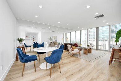 An airy, open-plan space with light oak floors, a