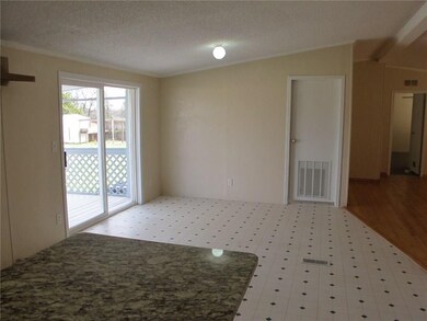 Dining area from kitchen to living.  (Door is to u