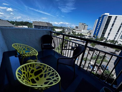 Balcony featuring a view of city