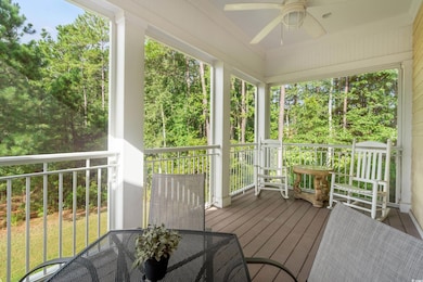 Unfurnished sunroom with ceiling fan