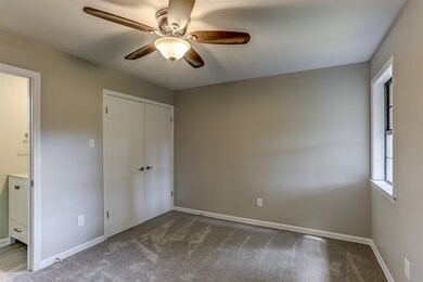 This bedroom is off of the small hall way by the f
