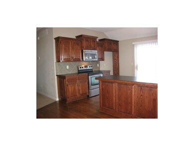 Gorgeous hardwoods and stainless appliances.