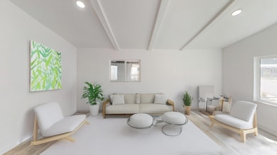 Sitting room with beamed ceiling, recessed lighting, and light wood-style floors