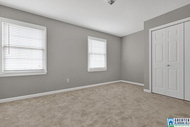 Large bedroom has an attached bath.