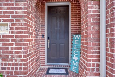 Front door of the home is solid wood.
