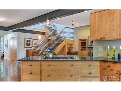 Honed granite countertops; custom maple cabinetry