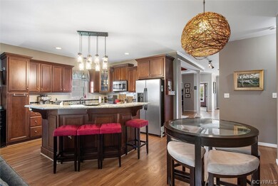 Kitchen featuring a kitchen island, pendant lighti