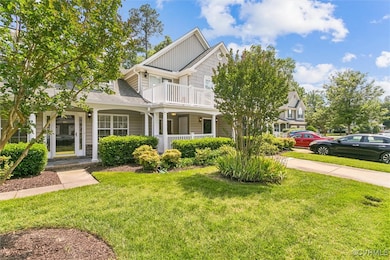 Craftsman house featuring covered porch, a front y