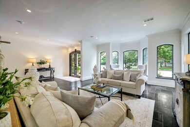The numerous windows throughout the space flood the area with natural light, highlighting the beautiful details of the home, and finishes throughout.