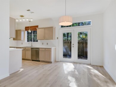 Kitchen with a sink, light brown cabinetry, stain