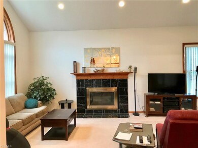 Beautiful gas fireplace and vaulted ceilings make 