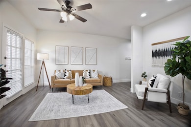 Living room featuring a ceiling fan, wood finished floors, and recessed lighting