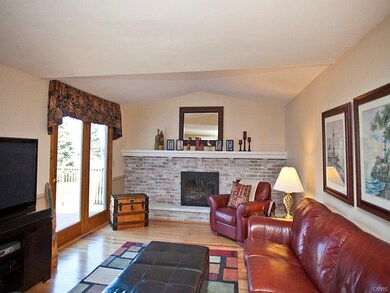 Family room has sliders to deck and gorgeous yard