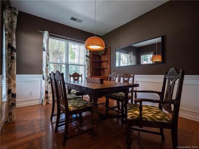 Dining room with beautiful wainscoting detail.