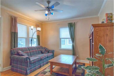 Living Room. Nice hardwood floors,  new windows ma